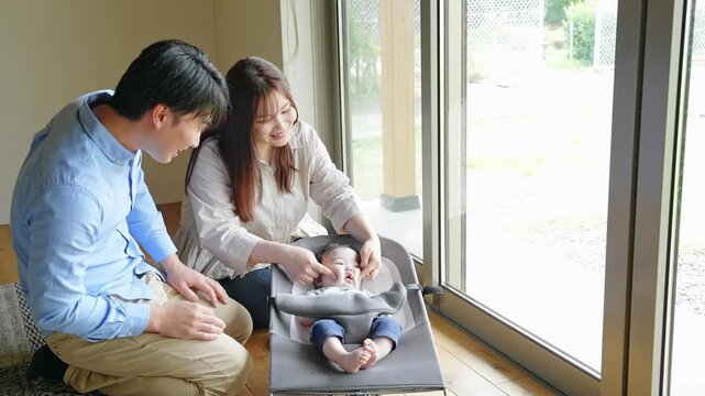 baby, infant, childcare, parent and child, family, birth, newborn, parenting, bouncer, cradle, soothing, babysitting, smile, gathering, home, child, boy, kid, couple, husband and wife, high chair, bou