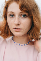 Blue Beaded Choker with Floral Design – Portrait of Young Woman