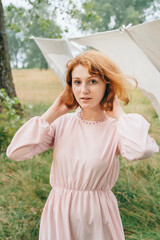 Woman Wearing Pink Dress and Purple Beaded Necklace Outdoors