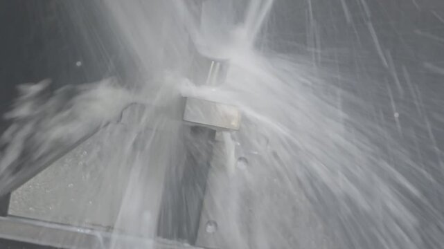 The pan scene 5 axis CNC milling machine with liquid coolant method.