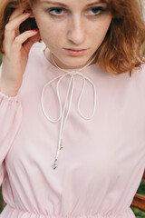 Close-Up of Pink Dress with Bow and Silver Heart Details