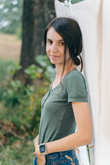 Stylish Woman Outdoors Wearing Smartwatch and Beaded Necklace