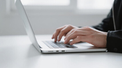 Person Typing on Laptop