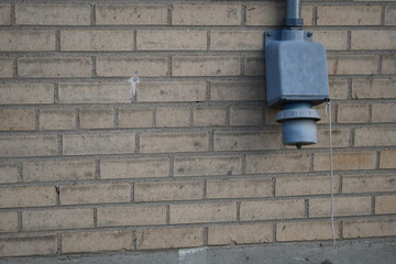 Generator hookup outlet. Older brick building.