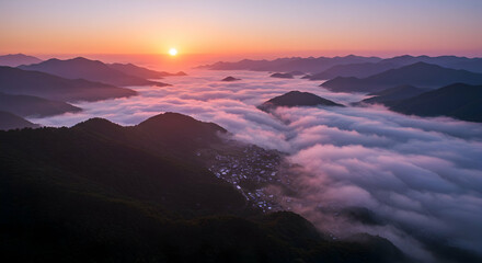 Obraz premium Sunrise over misty mountain village idyllic scenery