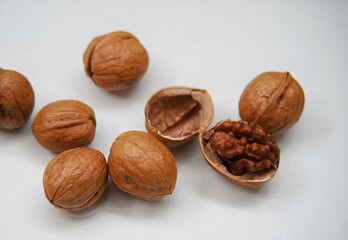 Ripe walnuts or Juglans or Kacang Kenari isolated on white background.