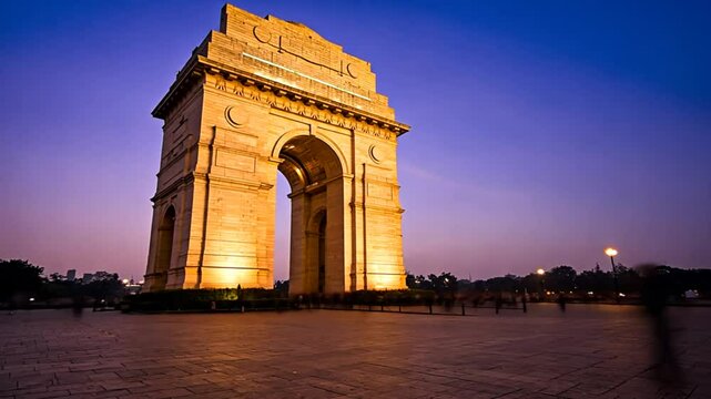 india gate twilight illumination empty plaza clear sky reflections