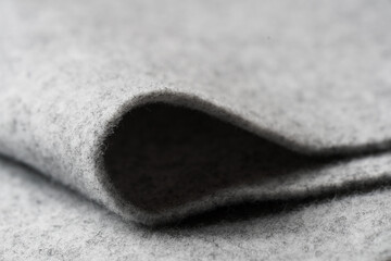 Graue Filztextur mit dichter Faserstruktur