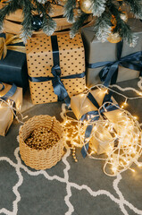 Wrapped holiday gift box under a decorated Christmas tree with lights. Festive surprise for celebration and winter interior.