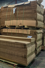 Stacks of Flat Corrugated paper boxes for shipping