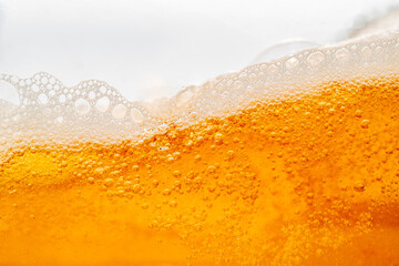 Close up bright orange Oil or beer splash texture and nature waves, Beautiful waves curve and...