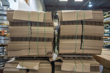 Stacks of Flat Corrugated paper boxes for shipping