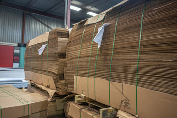 Stacks of Flat Corrugated paper boxes for shipping