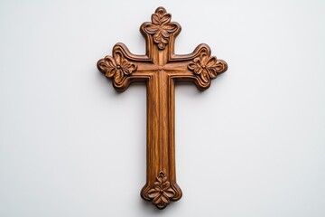 Ornate wooden cross with floral carvings, a religious symbol of faith and hope.