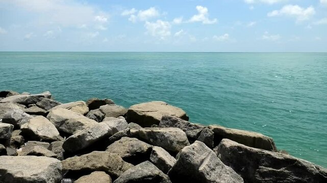 The beach at Dhanushkodi, Tamil Nadu, India lined with large boulders