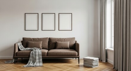 Modern living room featuring a plush brown sofa with draped blanket and three empty frames on a white wall