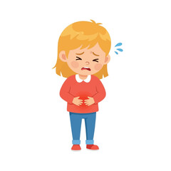 A young girl with blonde hair clutches her stomach, visibly experiencing pain or discomfort.