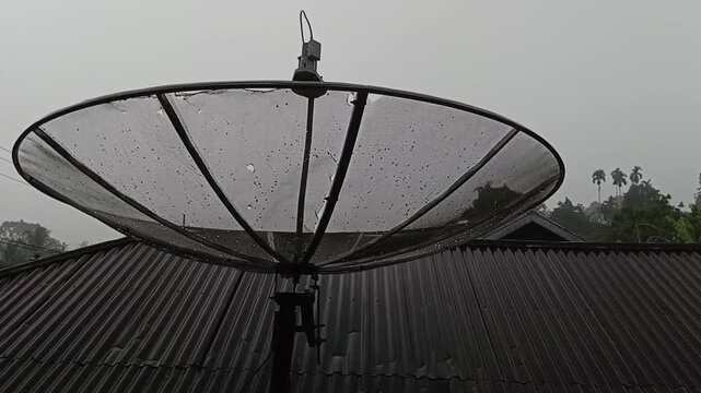 Raindrops are trapped between the parabolic net during a stormy rain