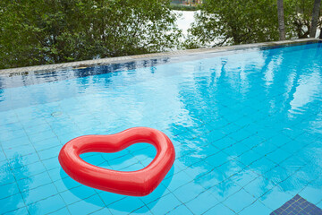 heart shaped float in the pool