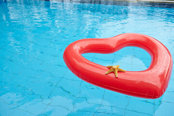 heart shaped float in the pool