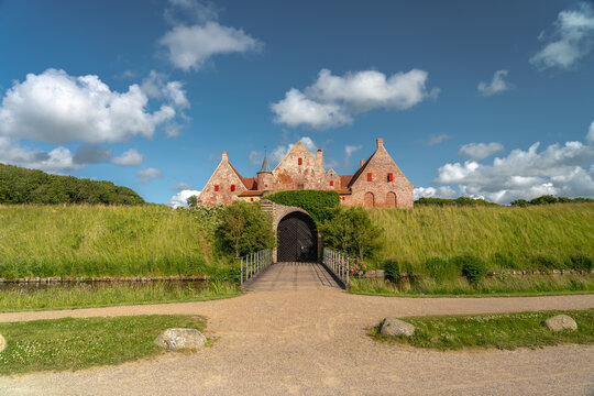 Sp&oslash;ttrup Borg, Denmark&rsquo;s best-preserved medieval castle, surrounded by double moats and lush countryside near Limfjord. Historic fortress and Renaissance gardens in scenic summer light 