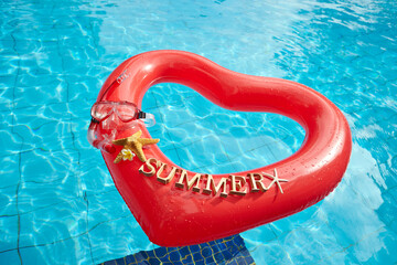 heart shaped float ,snorkeling, and summer items at the resort pool