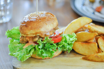 chicken burger or hamburger and french fries or chips