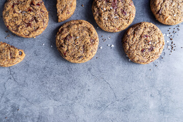 Perilla seeds chocolate chunk cookies on grey background.