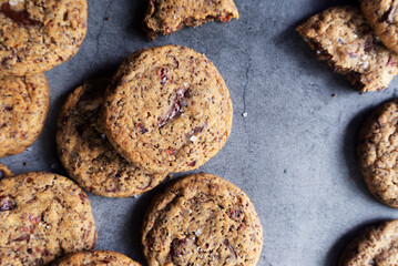 Perilla seeds chocolate chunk cookies on grey background.