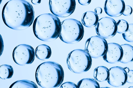 Transparent blue water bubbles floating on a light background. Abstract 3D render symbolizing hydration, freshness, purity, and skincare. Clean minimal concept for cosmetic or science themes.