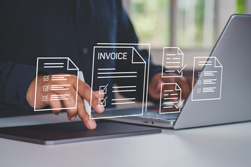 Digital invoice and billing management. Businessman using electronic invoice on laptop and tablet, finance tracking payments and taxes, electronic statements on virtual screen. E-tax, Digital receipt