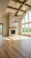 Interior view of a living room with stone fireplace and large windows in a modern home setting