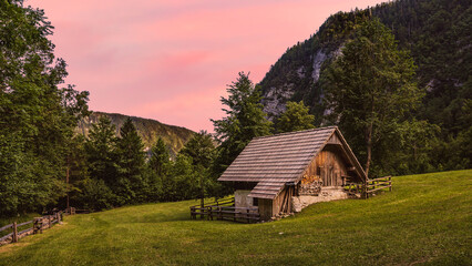 evening red lights - Mostnica river valley with meadow and cottage