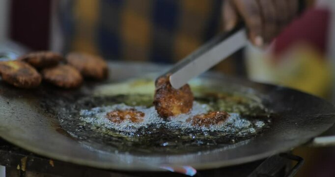 Frying chicken pakoda