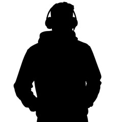 Silhouette of a young man wearing headphones and hoodie standing  