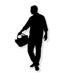 Man holding a basket while standing in a relaxed pose  