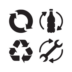 A set of four recycling related icons including arrows bottle wrench and recycle symbol in black color