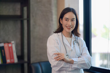 Portrait, medicine, and arms crossed with a woman doctor in the hospital for insurance or...