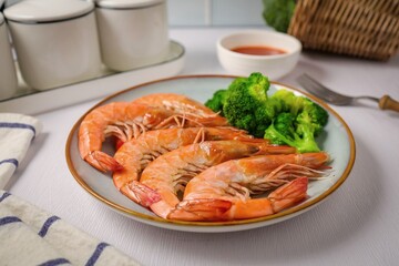 Boiled shrimp with Broccoli in ceramic plate on white background, clean meals