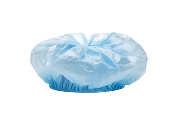 Single light blue disposable bouffant cap, isolated on black background.