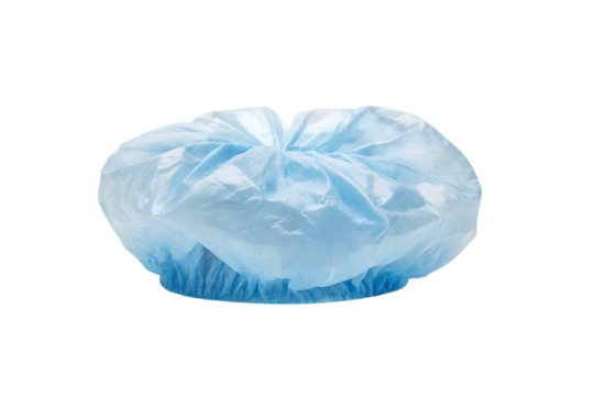 Single light blue disposable bouffant cap, isolated on black background.