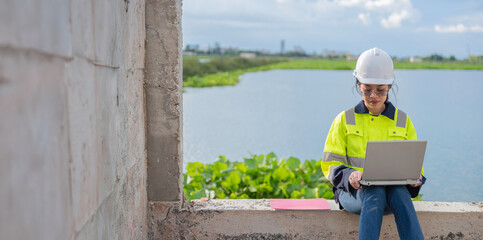 Environmental engineers work at the water storage plant, check the pH of the water, check the quality of the water.