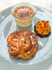 Swedish Dessert Plate with Cinnamon Bun, Creme Brulee and Chocolate-Dipped Coconut cookie