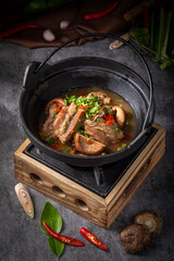 Bone Broth Comfort Food, Asian pork bone soup with herbs, pork bone soup in clay pot, pork bone soup recipe with chili and coriander
