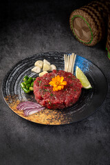 Raw Beef Asian Style, Modern Thai steak tartare with herbs, Thai steak tartare recipe, spicy Thai steak tartare dish in authentic Thai steak tartare style