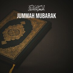 Jummah Mubarak in Arabic calligraphy means: Blessed Friday. With Quran - holy book of Muslims background. 