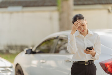 Fototapeta premium Asian woman calling insurance agent for help, fix car problem, help, emergency car repair