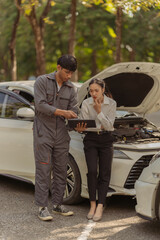 Insurance Agent Inspects Car Damage After Accident Cars damaged after car accidents are promptly...