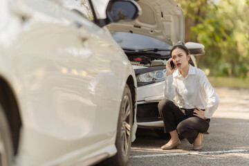 Asian woman calling insurance agent for help, fix car problem, help, emergency car repair