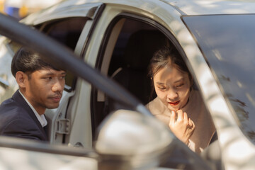 Male insurance agent inspects damaged car after accident and submits claim documents from insurance concept name selling